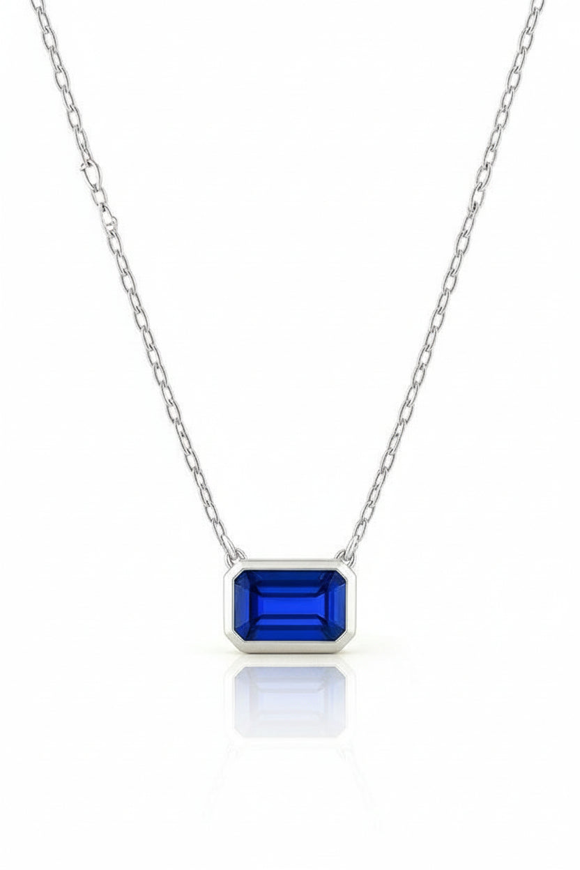 3ct Emerald-Cut Blue Sapphire Bezel Pendant in 14K White Gold with Adjustable 16